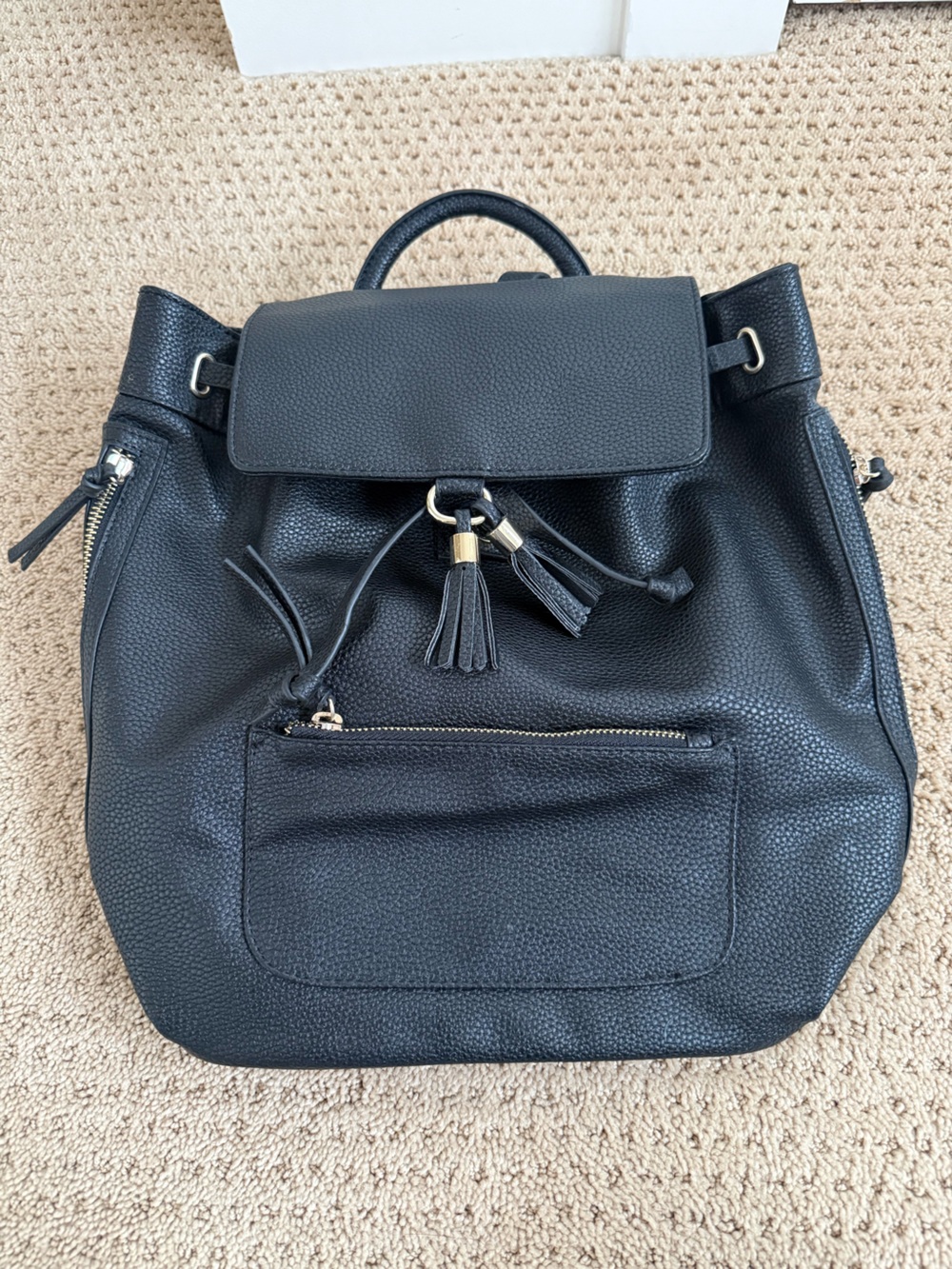 Indigo Black Pebbled Faux Leather Tassel Drawstring Backpack